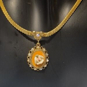 Vintage 1928 Gold Tone Necklace with Floral Cameo Style Pendant